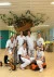 Groep verpleegkundigen bij de boom op de Kinderafdeling